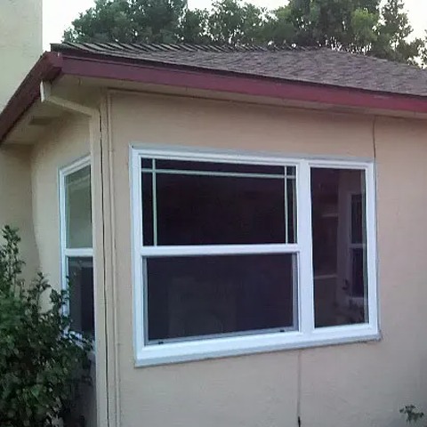 residential-window-exterior-with-clean-simple-design-symbolizing-comfort-and-privacy Residential window exterior with clean, simple design, symbolizing comfort and privacy, often reflected by funeral homes in Corona, CA to create a शांत and welcoming space for families during visitations and memorial services.