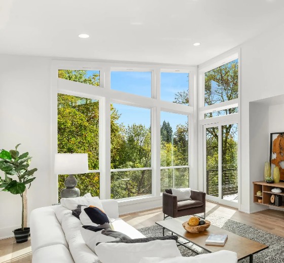 Large energy-efficient windows filling a modern Temecula, CA home with natural light and scenic outdoor views.