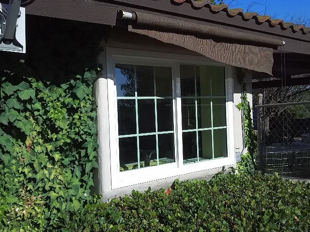White replacement sliding windows improving energy efficiency and curb appeal for a home in Temecula, CA.