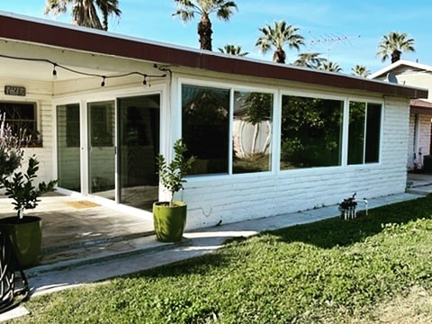 Modern replacement windows brighten a home exterior and backyard in Corona, CA.